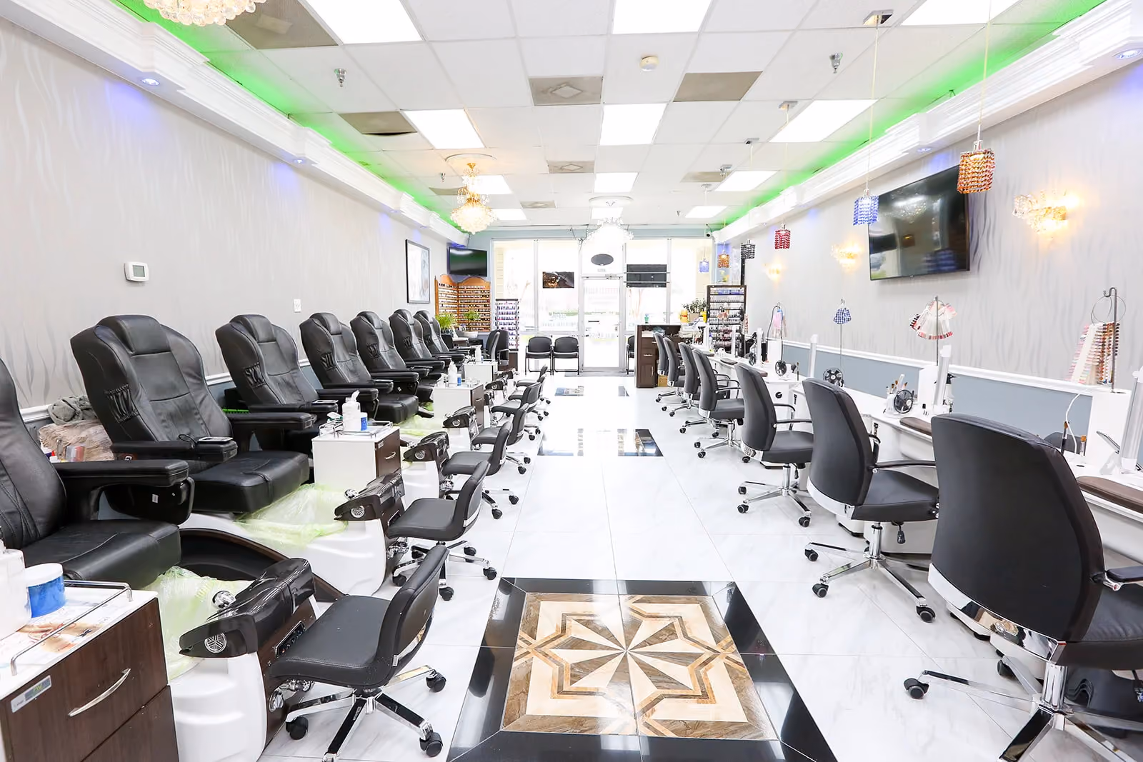 Inside Crystal Nails Norfolk: pedicure chairs and manicure stations in soft light